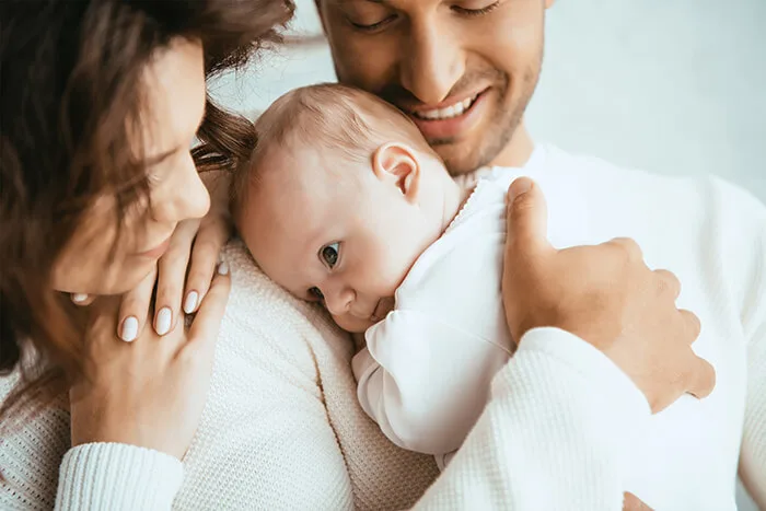 Parent balancing family time and work, representing supportive parental leave and an inclusive workplace culture.